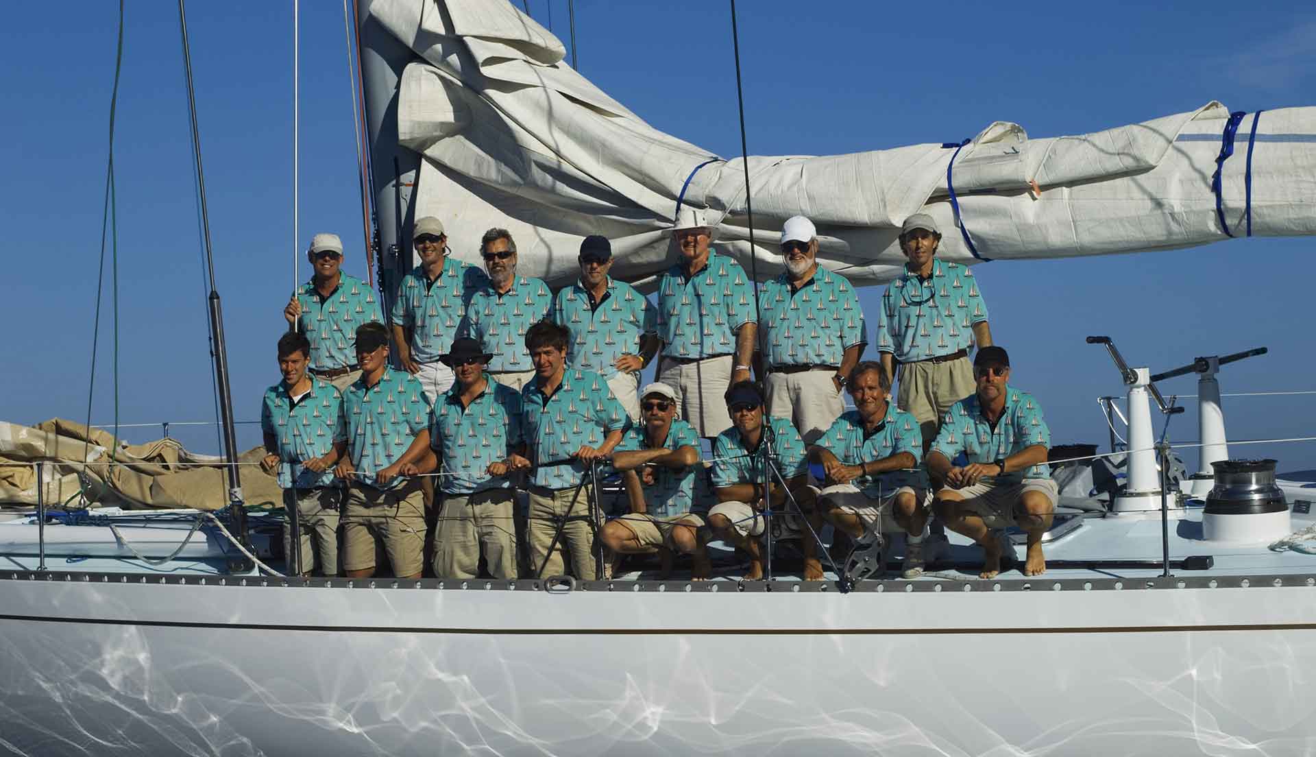 a sailboat full of sailors wearing captain boatiful designed personalised hawaiian shirts